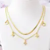 Double-Layer Flat Snake Collarbone Chain Necklace with Irregular Four-Leaf Flower Pendant